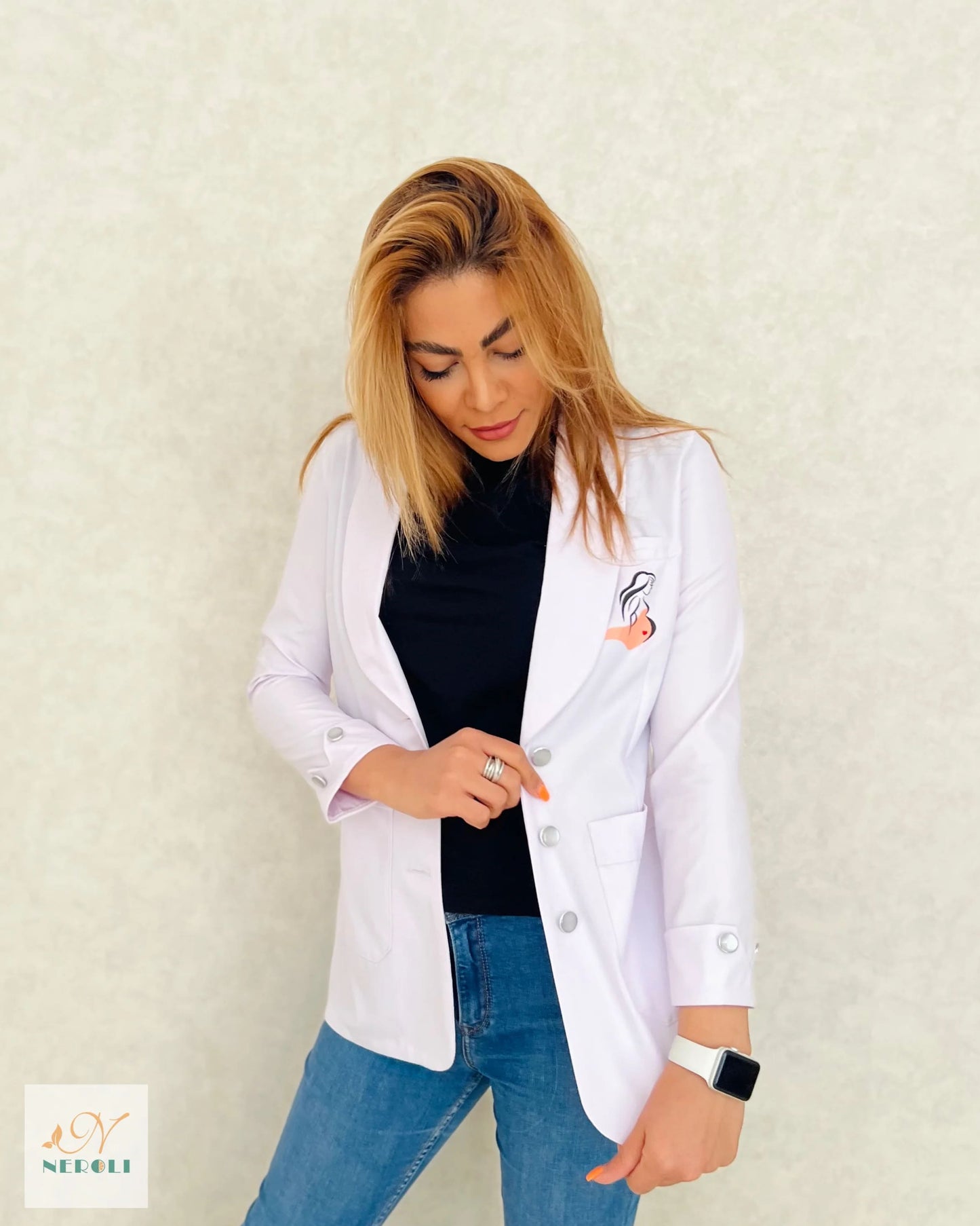 Female gynecologist standing confidently in a stylish pose, wearing a short white lab coat