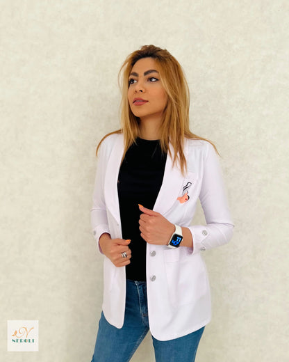 Healthcare professional standing confidently in a stylish pose, wearing a white coat - a symbol of professionalism in the medical field.